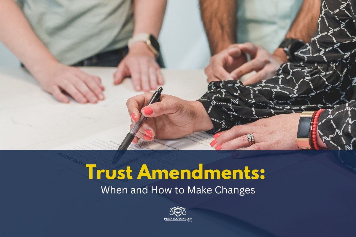 A person with manicured nails and jewelry signs a document, while two other individuals observe